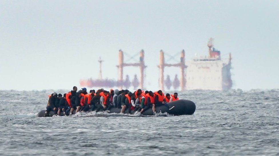 Individuals believed to be migrants cross the Channel in August