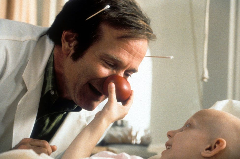 Robin Williams with a child actor in Patch Adams