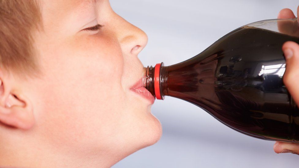 Child drinking a fizzy drink