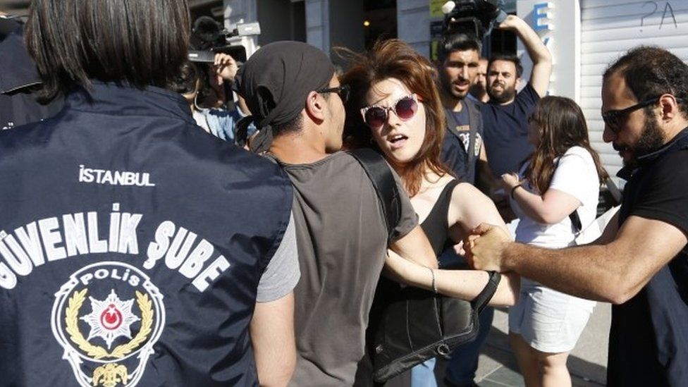 A participant is detained by Turkish police during the Istanbul LGBT Pride Parade