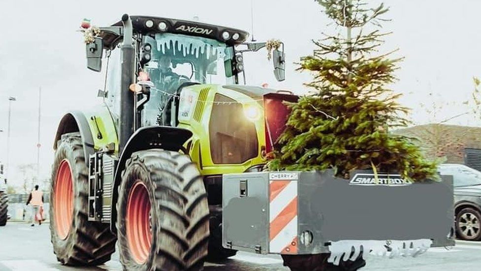 A tractor in Christmas lights