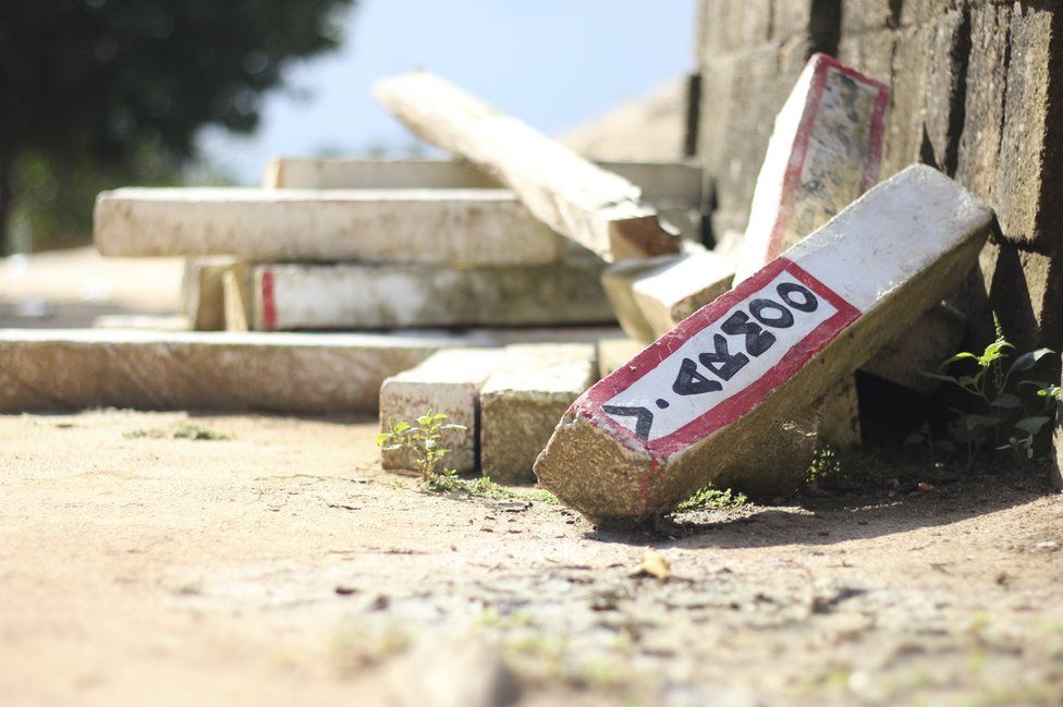 The discarded signs previously used to identify farm boundaries in the farming village of Bentum