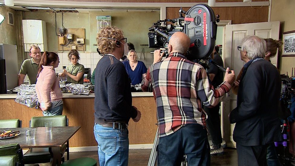 Film crew shooting kitchen scene