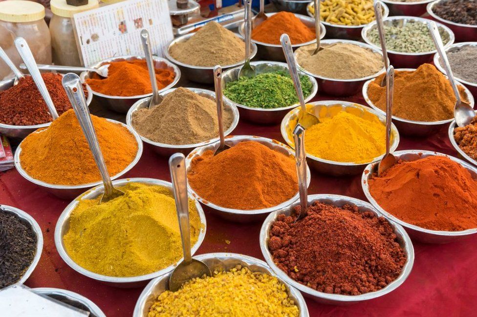 Spices, herbs and curry powders on display at Anjuna Beach Flea Market, Goa, India.