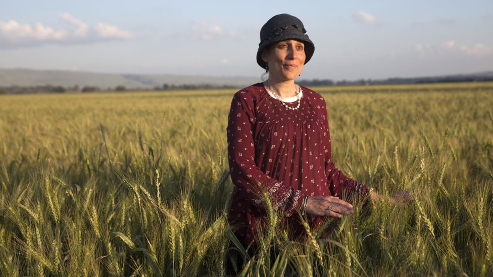 Shani Taragin, 45, a women's health and Jewish law teacher, in a wheat field at the Hula Valley in the Upper Galilee in northern Israel during the Passover holiday. (Photo by Heidi Levine for The BBC).