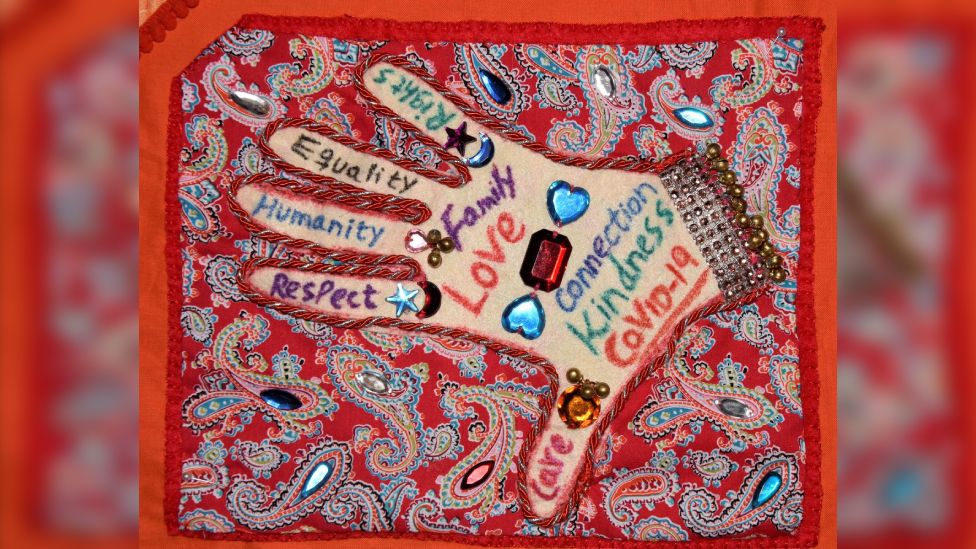 Rohilla hand on quilt