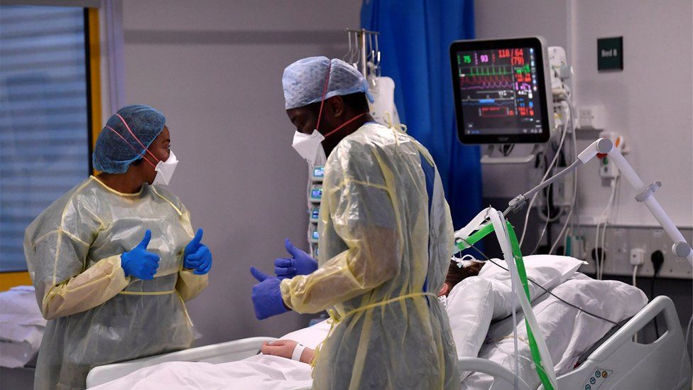 Nurses react as they treat a Covid-19 patient in the ICU (Intensive Care Unit) at Milton Keynes University Hospital in April 2021