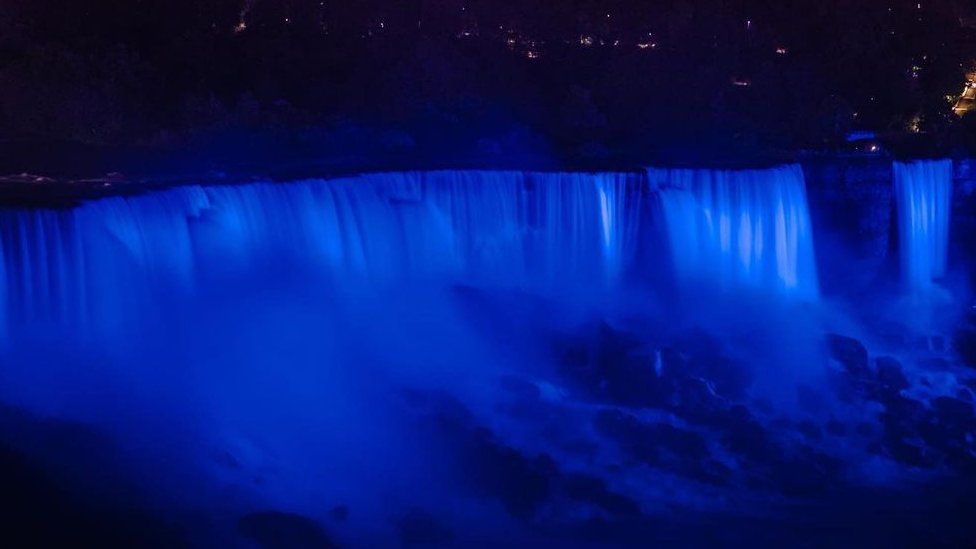 Photo of Niagara Falls at night lit up blue