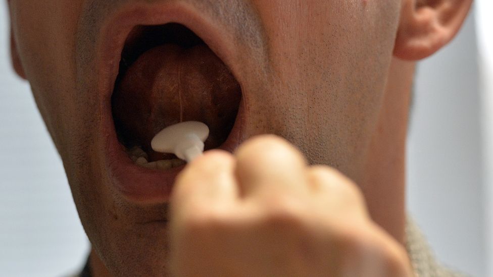 Man's mouth being swabbed