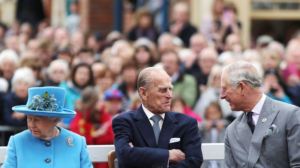 Queen Elizabeth II, the Duke of Edinburgh and the Prince of Wales, during a visit to Poundbury, a new urban development on the edge of Dorchester