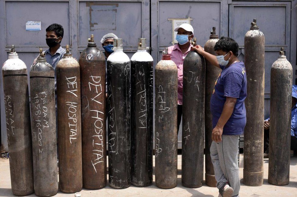 Family members of Covid-19 infected people in a queue with empty oxygen cylinders outside a filling centre at Sector 14 on April 29, 2021 in Gurugram, India.