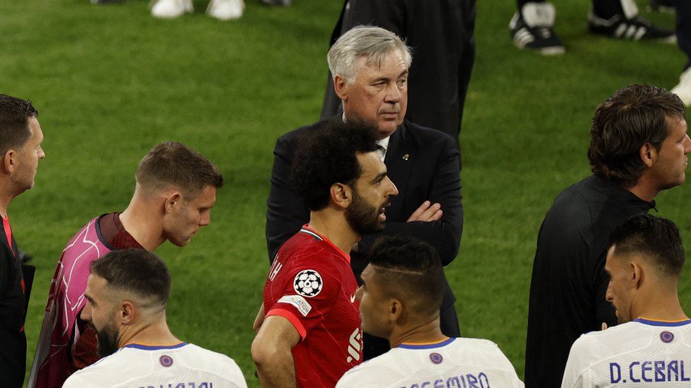 Liverpool's Mohamed Salah and James Milner receive a guard of honour from the Real Madrid players and Carlo Ancelottie