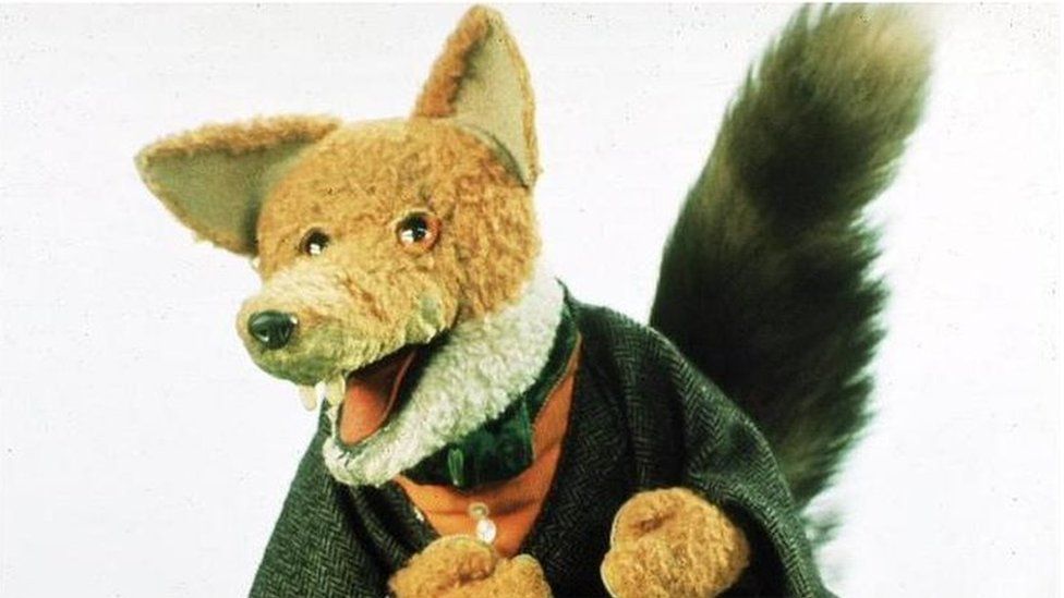 Basil Brush fox character wearing his green jacket.