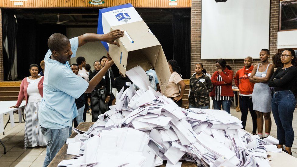 An Independent Electoral Officer (IEC) opens a ballot box as counting begins at the Addington Primary School after voting ended at the sixth national general elections in Durban, on May 8, 2019.