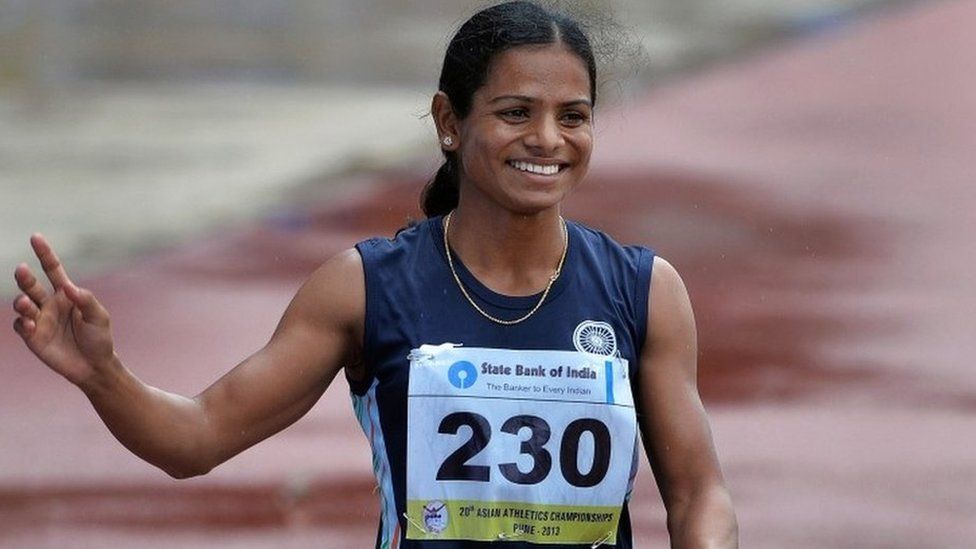 In this photograph taken on July 7, 2013, women"s 200 meters bronze medal winners from India, Dutee Chand waves to the crowd after the race on the fifth and the final day of the Asian Athletics Championship 2013 at the Chatrapati Shivaji Stadium in Pune.