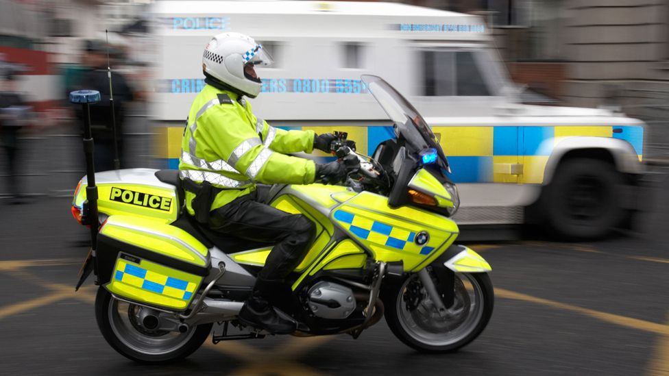 SNI Police Service Northern Ireland motorcycle officer speeding through belfast