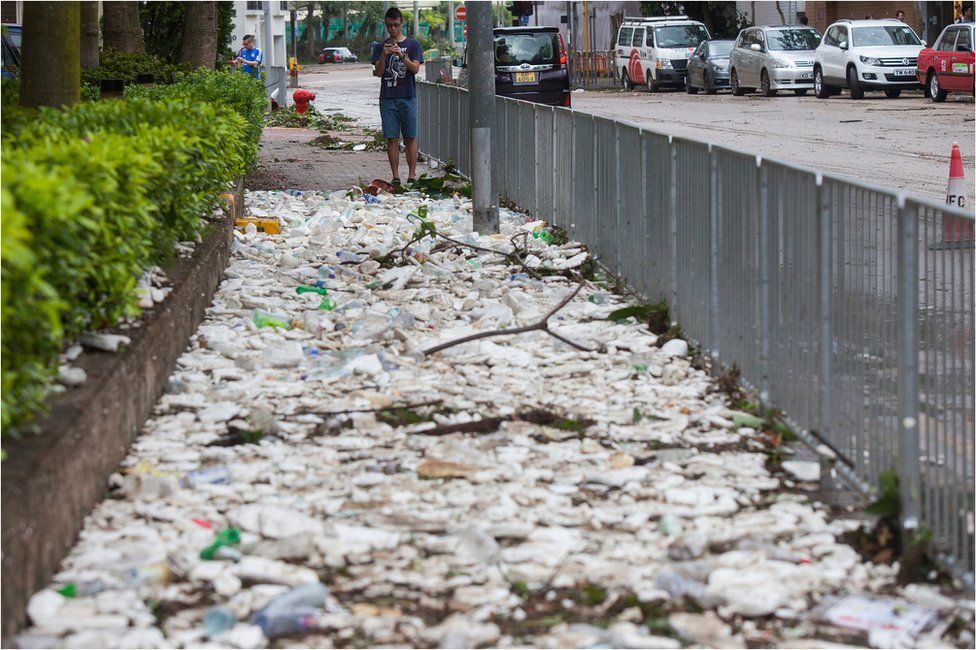 A sidewalk is covered with debris after the passing of Typhoon Hato at Heng Fa Chuen, Hong Kong, China, 23 August 2017