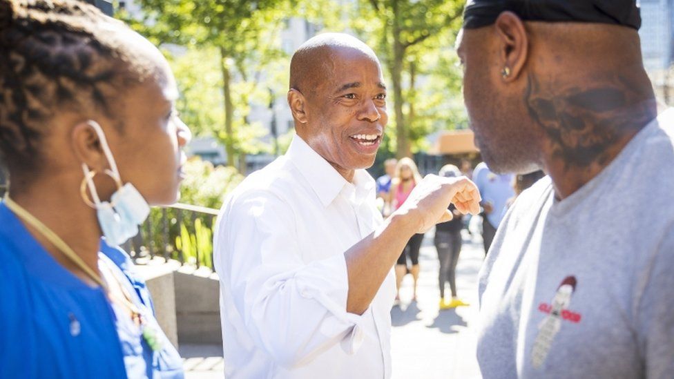 Eric Adams campaigning outside his office in Brooklyn, NY 24 June 2021