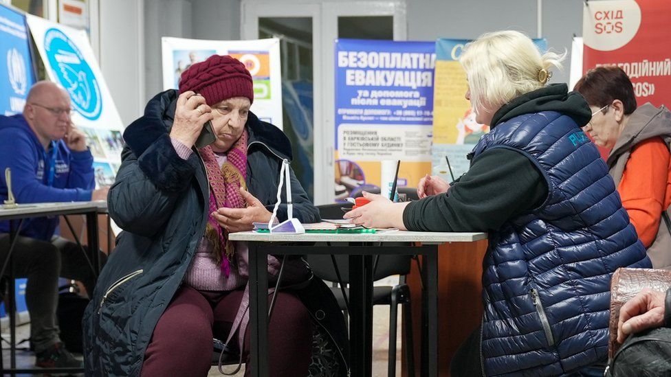 Zoya makes a phone call to her son from the reception centre