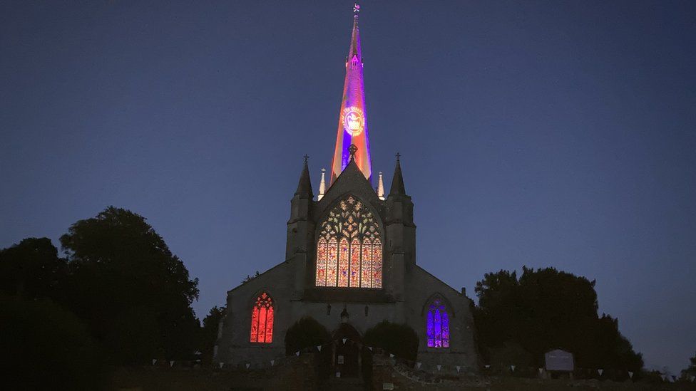 The landmark spire of St Mary's Snettisham, Norfolk, illuminated for the jubilee