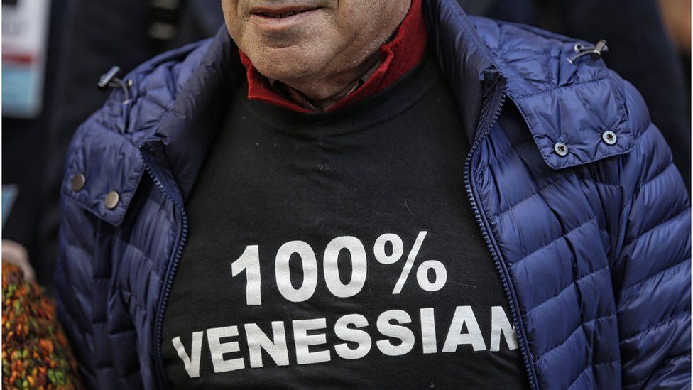 A man wearing a tee-shirt reading ""100% Venetian"" takes part in a demonstration against the increasing number of tourists in Venice, on November 12, 2016.