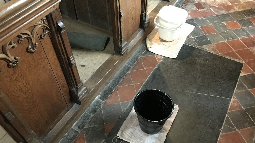 Bucket on a church floor
