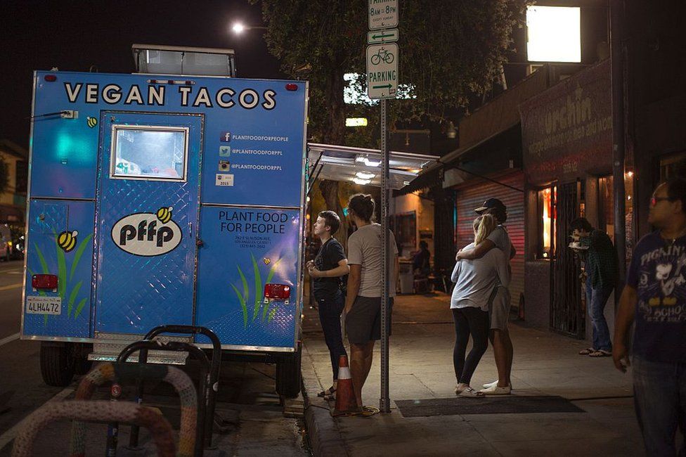 People queue for vegan tacos in Los Angeles