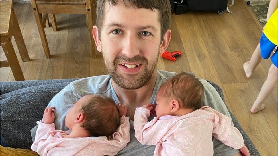 Alex Wright with newborn twins Eden and Indie.