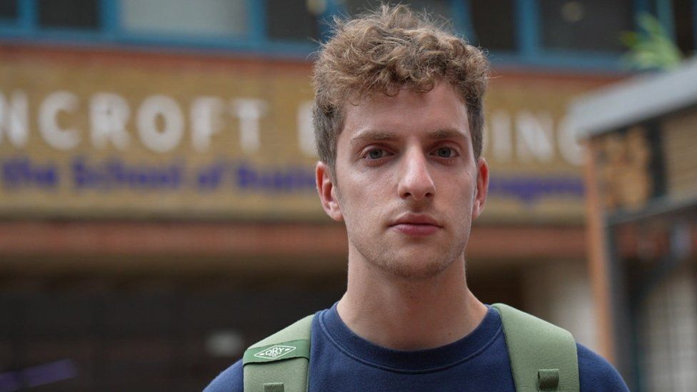 Image of Elliot Berke, a student standing outside of Queen Mary University London's Bancroft Building.