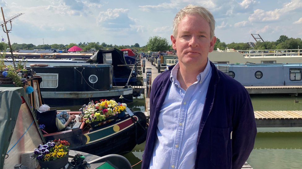 Devizes MP, Danny Kruger, next to canal boats at Caen Hill Marina