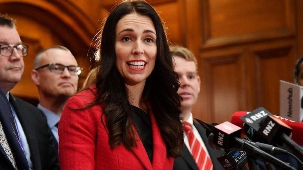 New leader of the Labour Party Jacinda Ardern (C) speaks with her front bench at her first press conference at Parliament in Wellington on August 1, 2017
