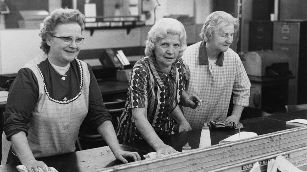 Three office cleaners at work after hours, October 1973. They are Mrs Mabel Warren, Mrs Betty Stone and Mrs Flo Ring