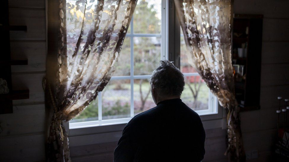 Lonely person staring out window