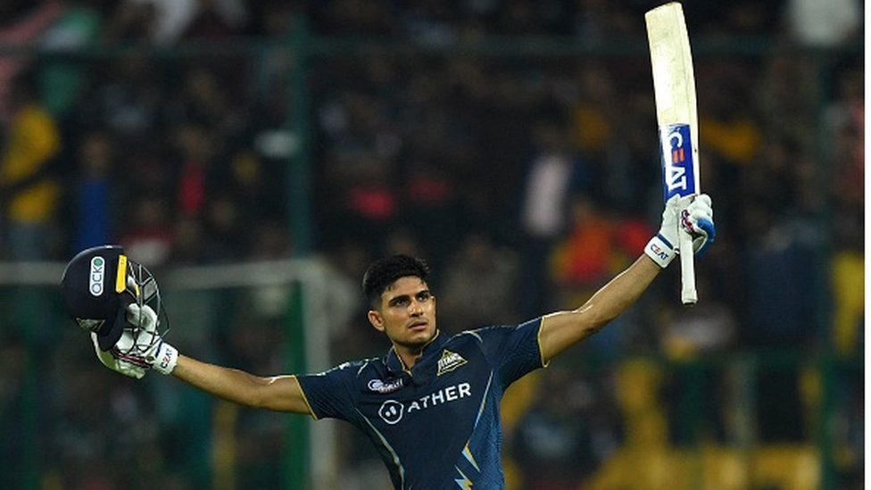 Gujarat Titans' Shubman Gill celebrates after scoring a century (100 runs) and winning the Indian Premier League (IPL) Twenty20 cricket match between Royal Challengers Bangalore and Gujarat Titans at the M Chinnaswamy Stadium in Bengaluru on May 21, 2023
