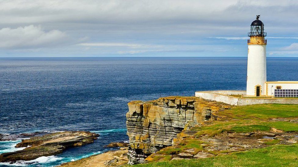 Lighthouse powered with solar energy, Westray, Orkney islands, Scotland - stock photo