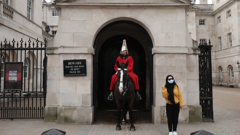 Tourist with horse guard