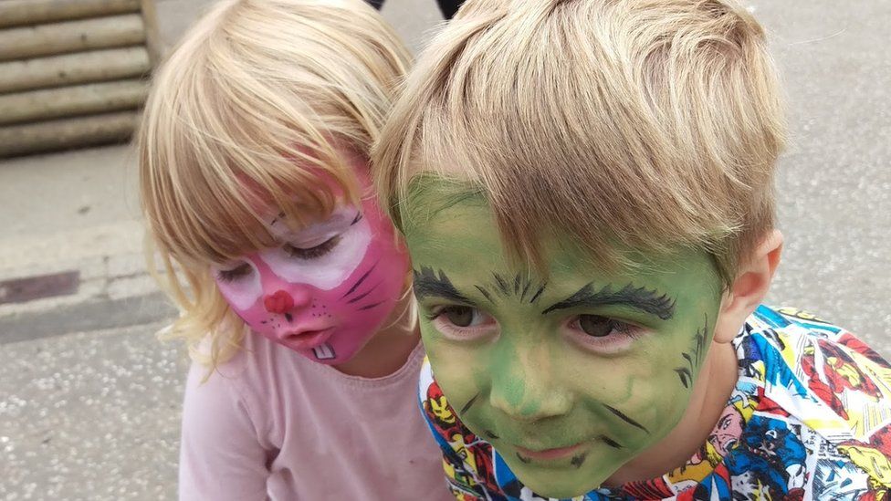 Finnbar Cork and his sister Nell wearing face paint
