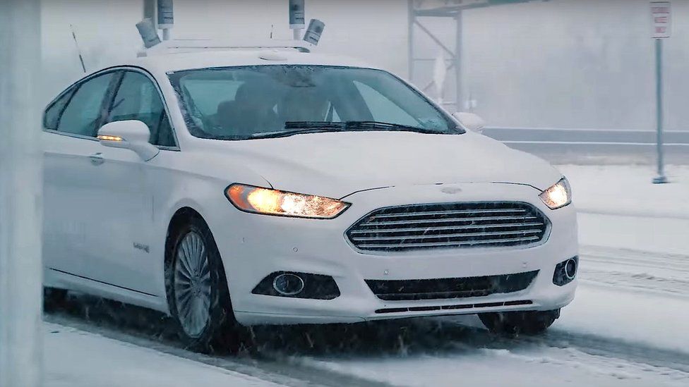 A Ford autonomous car driving in the snow