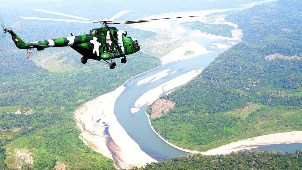 Peruvian Army helicopters overfly the tactical VRAEM area, between the rivers Ene, Apurimac and Mantaro, some 280 km south east of Lima, on August 5, 2015, as part of operations against terrorism and drug trafficking in the region