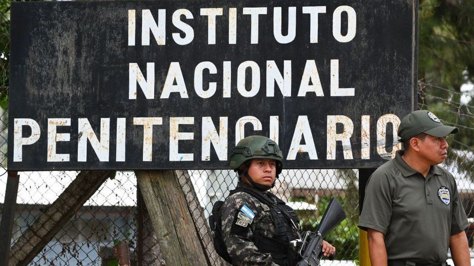 Honduran soldiers guard the women's prison in Honduras where more than 40 people died