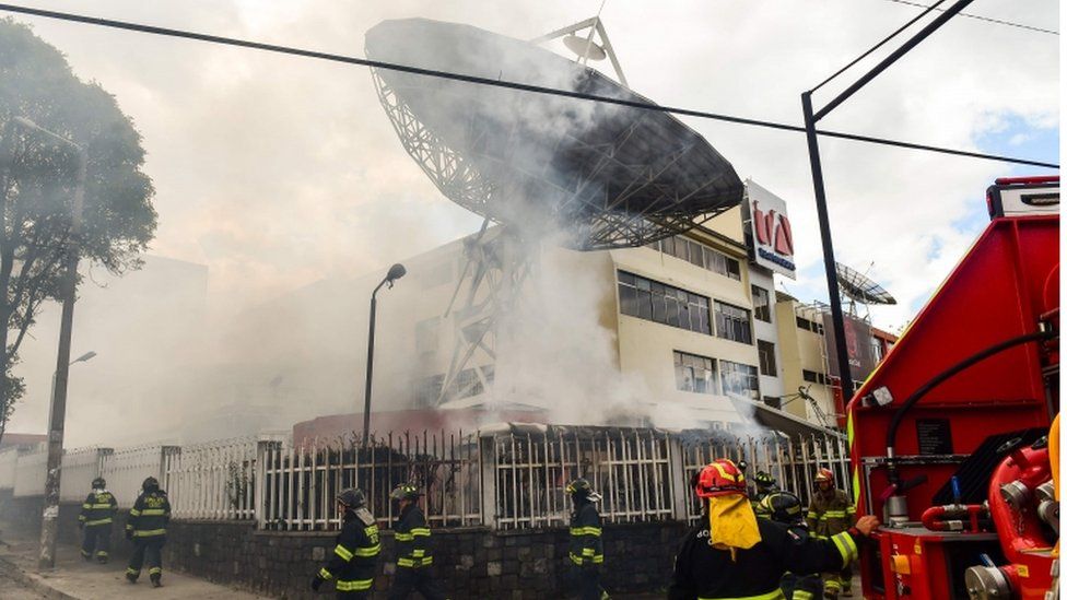 Firefighters work to extinguish a fire at Ecuadorean TV station Teleamazonas offices. 12 Oct 2019