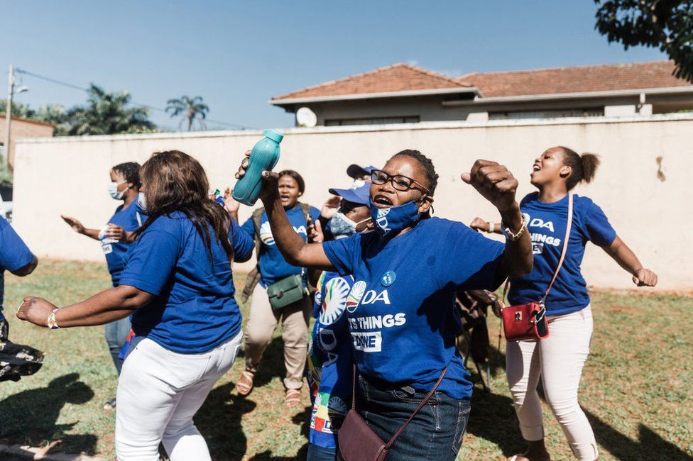 Democratic Alliance (DA) supporters sing and chant outside at the polling station at Northwood Boys High School in Durban on 1 November.