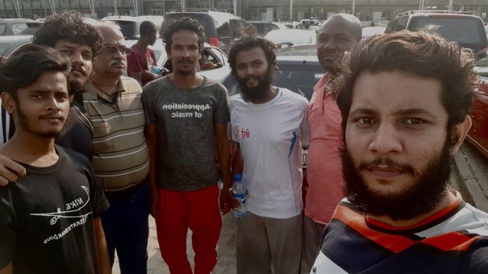 The sailors pictured in Nigeria soon after their release