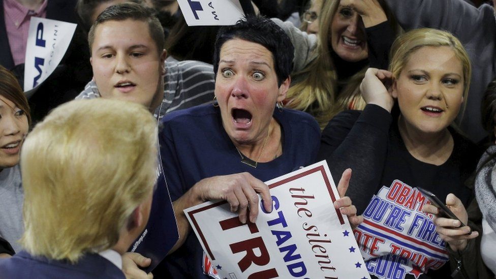 Audience member Robin Roy reacts as Donald Trump greets her at a campaign rally in Lowell, 4 January 2016