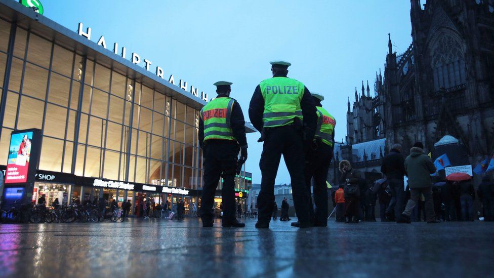 Police stand guard outside Cologne Station (11 Jan)