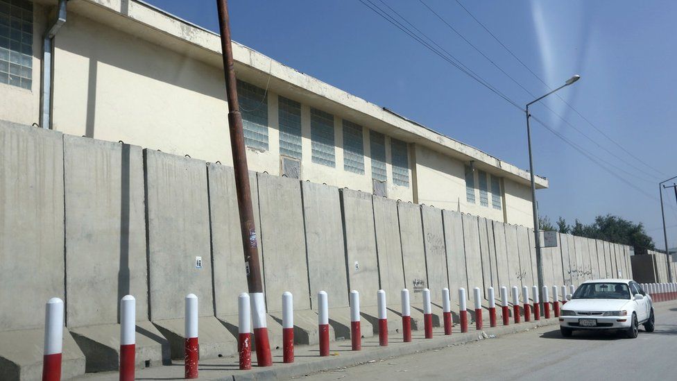 A car passes American University of Afghanistan in Kabul, Afghanistan, Monday, Aug. 8, 2016