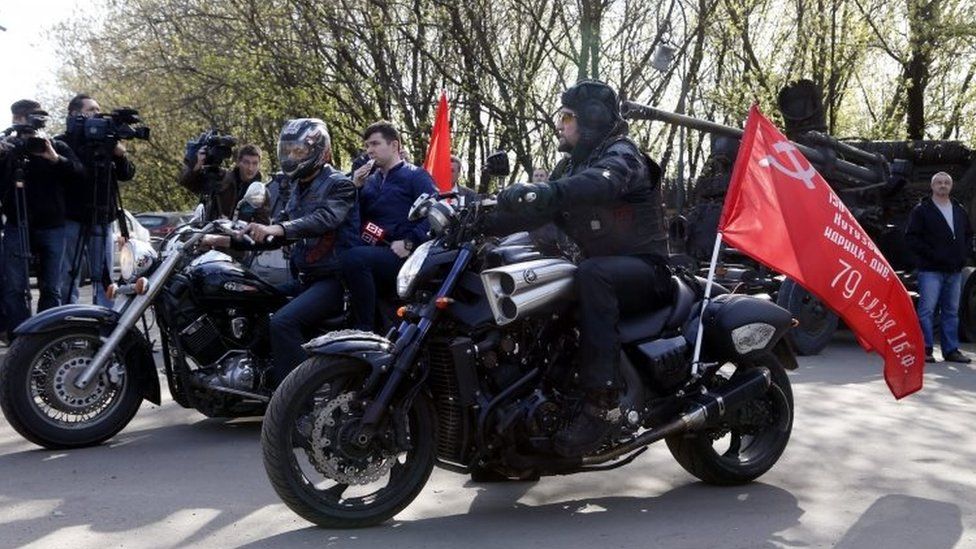 Night Wolves leader Aleksandr Zaldostanov (right, on a bike) his colleagues before the start of their rally in Moscow, Russia. Photo: 29 April 2016