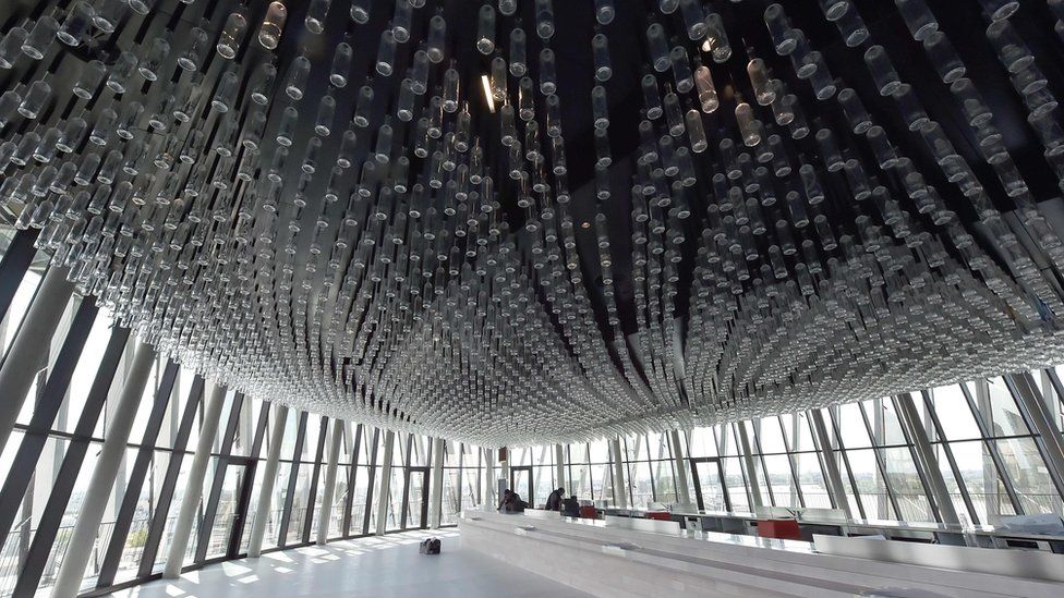 A picture taken on 24 May 2016 shows the room with panoramic view where the ceiling lights is made of thousands of bottles in Bordeaux's new wine museum