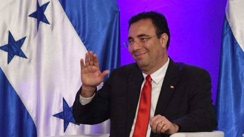 The presidential candidate of the opposition Liberal Party, Luis Zelaya, waves while participating in a presidential debate in Tegucigalpa on November 2, 2017, ahead of the November 26 general election
