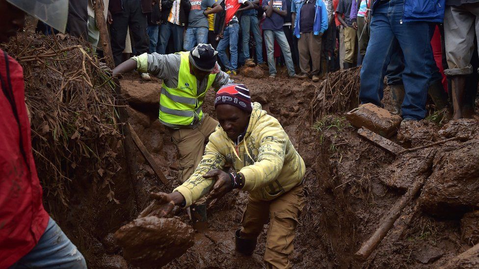 Villagers dig through mud as they attempt to find survivors of flash flooding at Solai in Subukia, Nakuru County on May 10, 2018,